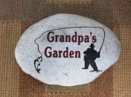 Grandpas garden stone with a fisherman