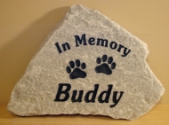 Buddy remembered forever with pawprints in stone