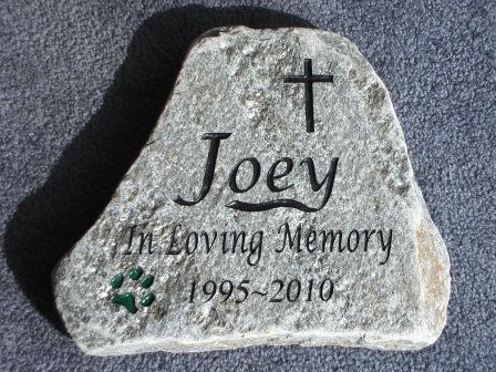 A paw print helps remember Joey in stone
