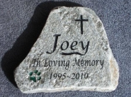 A paw print helps remember Joey in stone